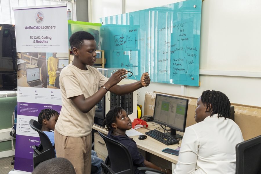 A learner presenting to classmates during an AeRoCAD session