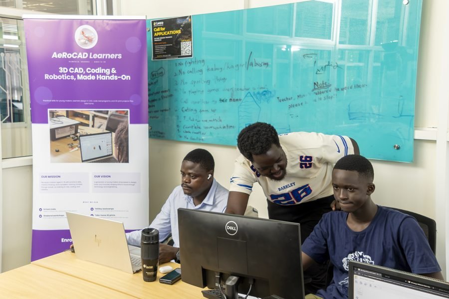 A learner explaining a project to the group in the lab